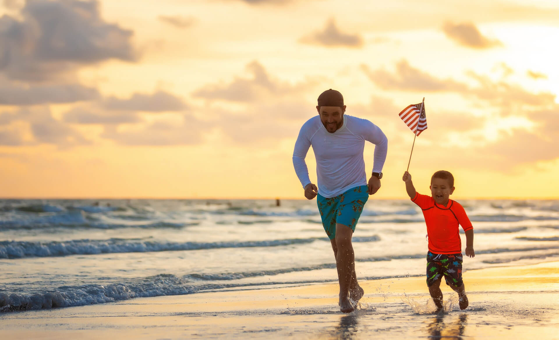 Boy running with American Flag