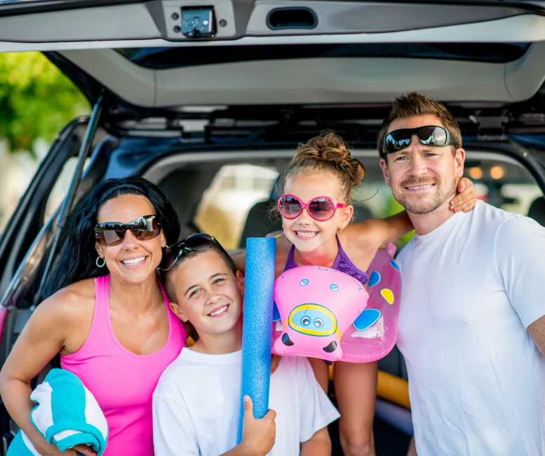 Family getting ready to go swimming. 