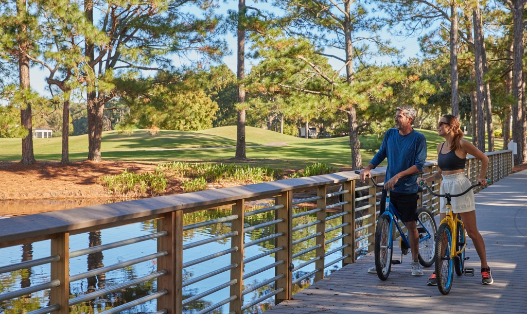 Couple biking on resort